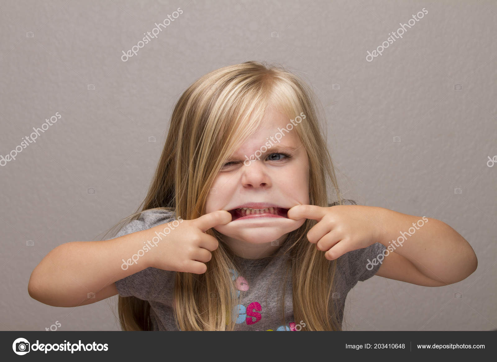 Girl Taking Her Mouth Pulling Her Lips Far Apart Make Stock Photo by