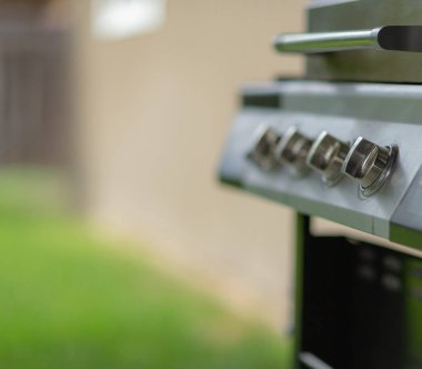 a bbq grill waiting for someone to turn it on. clipart