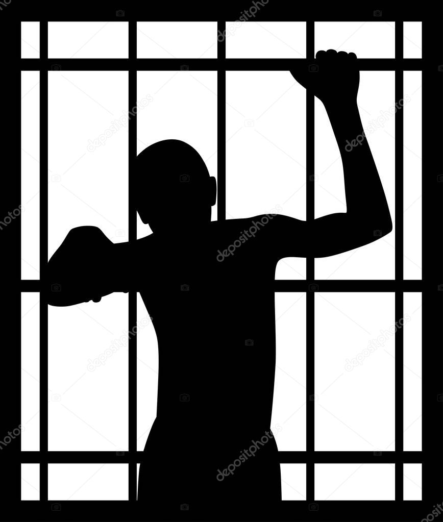 Man in prison behind bars