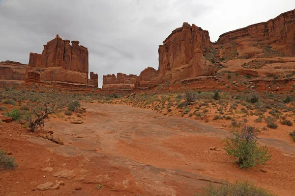 The Park Avenue Trail, with lots of overcast sky, in Arches National Park, near Moab, Utah.