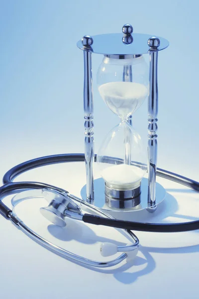 Stethoscope Hourglass Blue Background — Stock Photo, Image