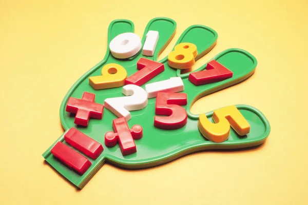 Plastic Hand Numbers Yellow Background — Stock Photo, Image