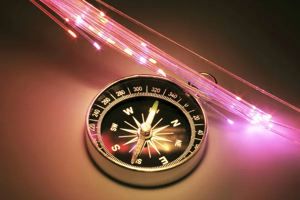 Kompass Med Optiska Fibrer Varma Bakgrund — Stockfoto