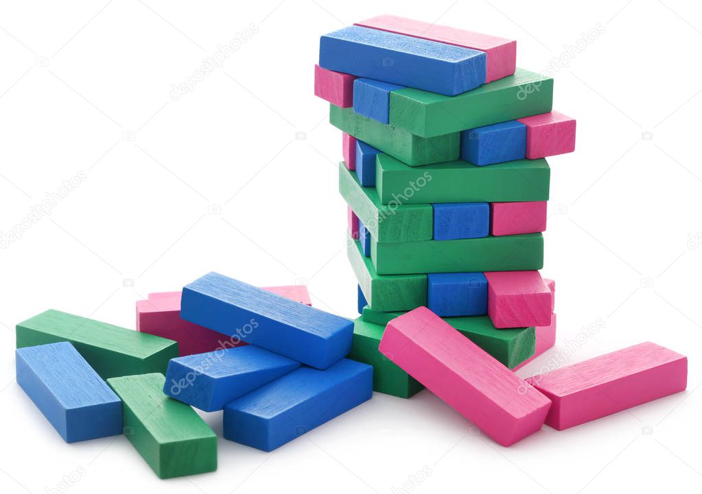 Jenga building of colorful wooden blocks