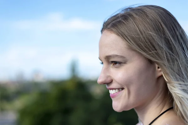 laughing young woman with blond hairs