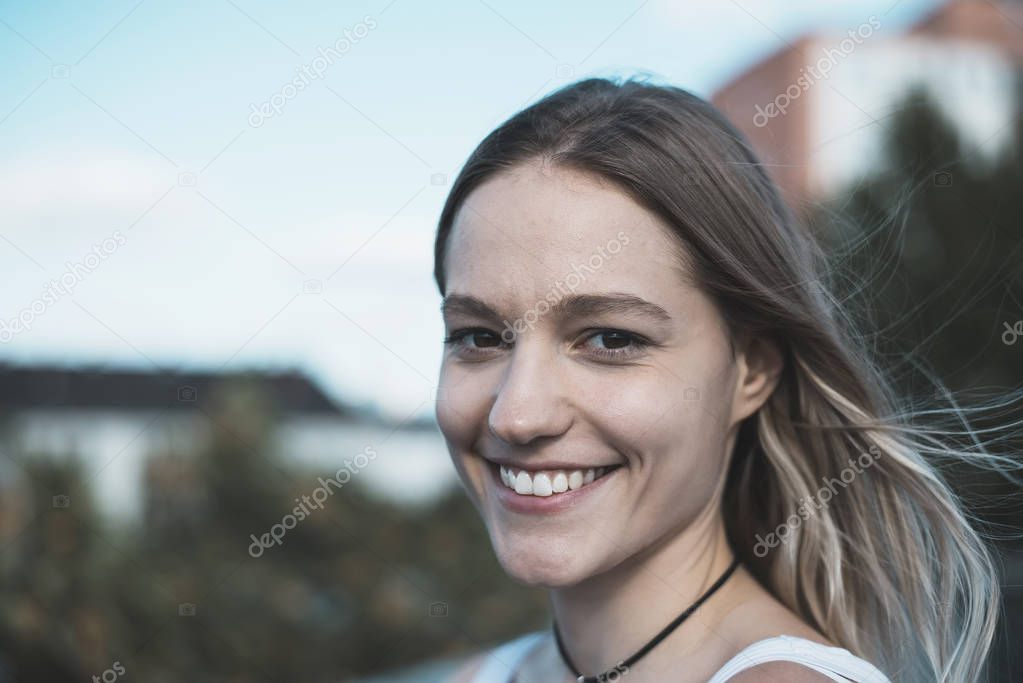 laughing young woman with blond hairs