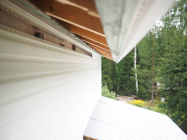 Çerçeve ev inşaatı. Siding yükleme