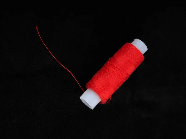 Reel Red Thread Black Background — стоковое фото