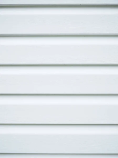 Λευκή πλευρά στον τοίχο του σπιτιού. όμορφο φόντο — Φωτογραφία Αρχείου