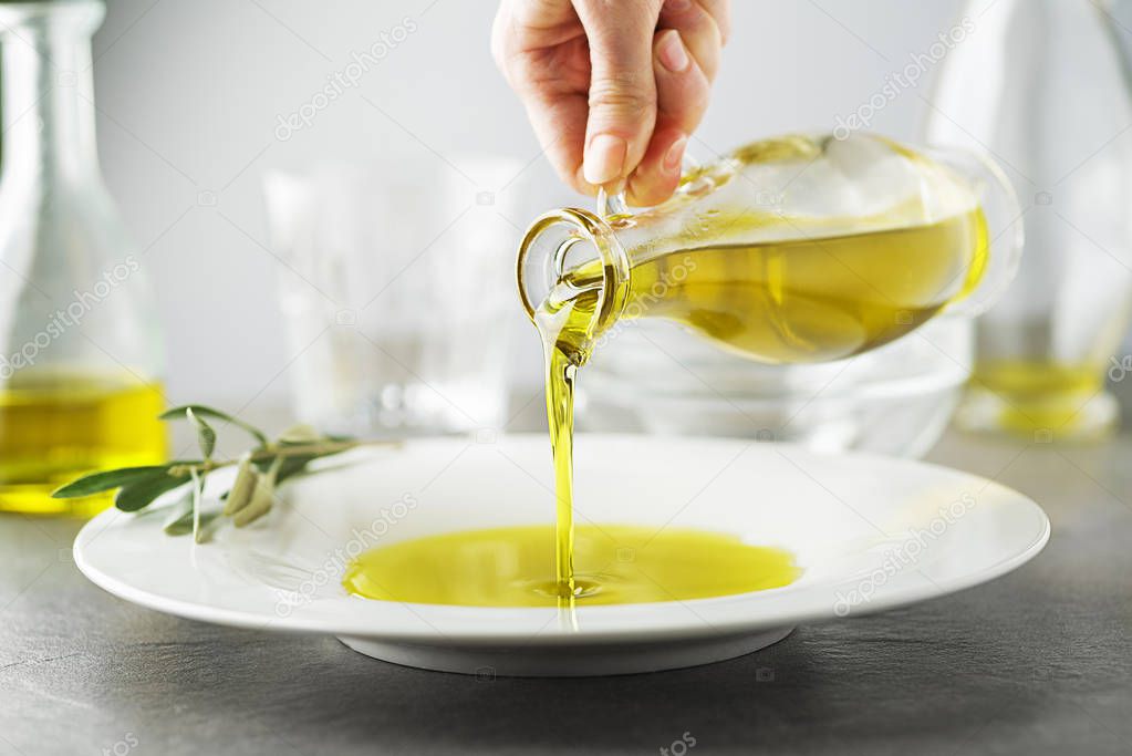Olive oil bottle pouring