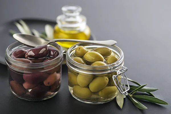 Green and black Olives in jar