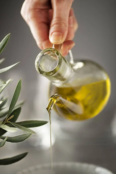 Olive oil bottle pouring