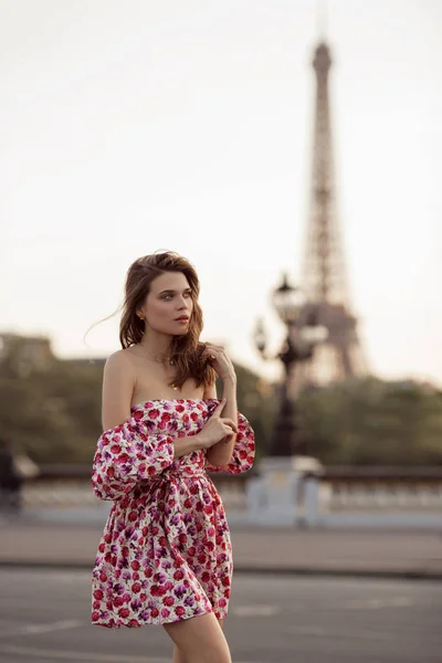 Beautiful girl is walking in Paris with Eiffel tower view , France