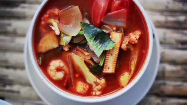 Top view of spicy prawns soup on a wooden table. 1920x1080 — Stock Footage Top view of spicy prawns soup on a wooden table. 1920x1080 Royalty Free Stock Footage