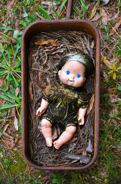 Creepy Grungy Old Baby Doll Laying Rusted Metal Wagon — Stock Photo, Image