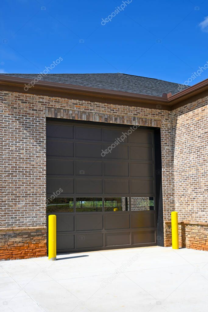 A Large Garage Door Installed on a New Commercial Building