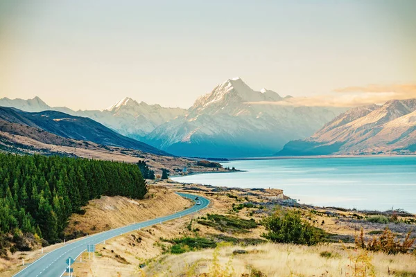 Road to Mt Cook, the highest mountain in New Zealand. Scenic highway drive along Lake Pukaki in Aoraki Mt Cook National Park, South Island of New Zealand.