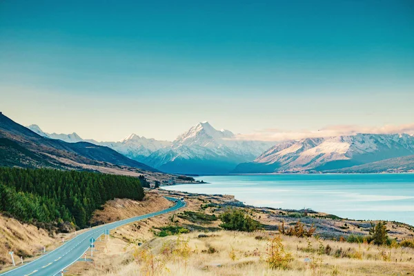 Road to Mt Cook, the highest mountain in New Zealand. Scenic highway drive along Lake Pukaki in Aoraki Mt Cook National Park, South Island of New Zealand.