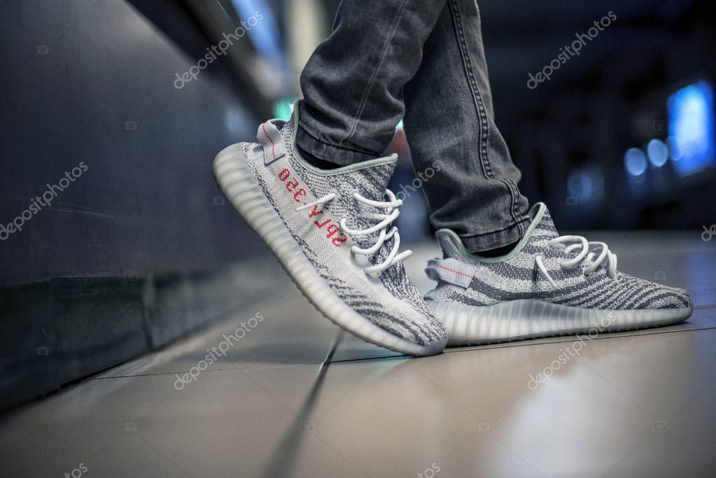 Milan, Italy - January 01, 2018: Man wearing a pair of Adidas Yeezy in the street