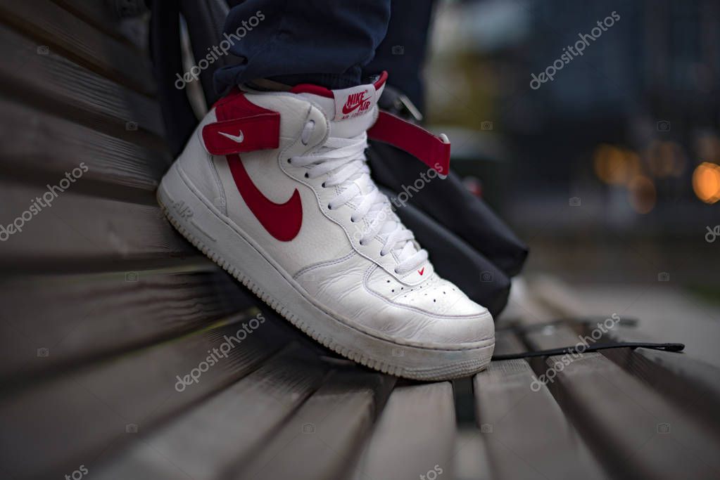 Milan, Italy - November 4, 2018: Young man wearing Nike Air Force high shoes in the street - illustrative editorial