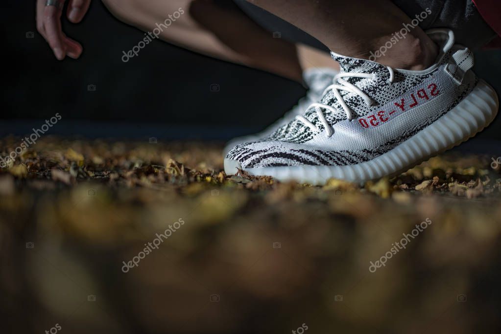 Milan, Italy - July 08, 2018: Man wearing a pair of Adidas Yeezy in the street
