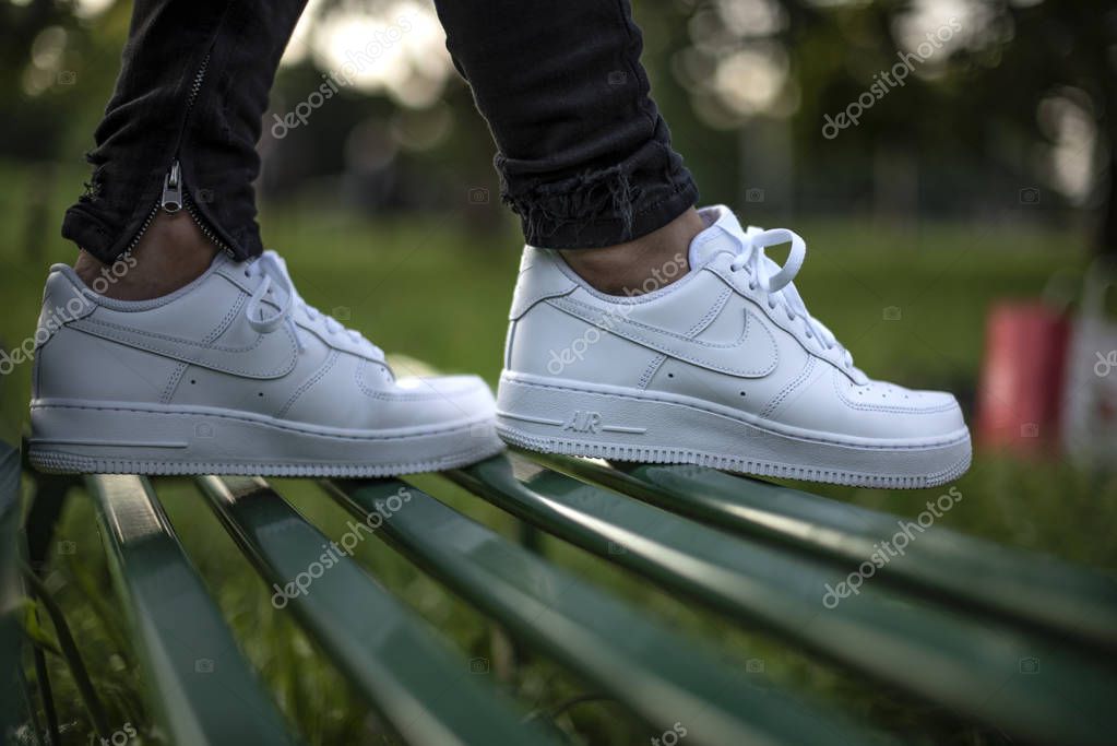 Milan, Italy - June 3, 2019: Young man wearing a pair of Nike Air Force