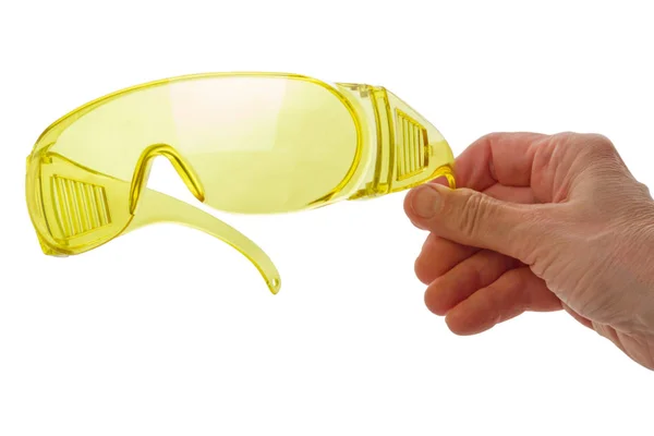 Hand with plastic safety glasses — Stock Photo, Image