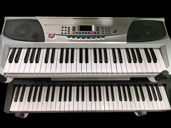 Two keyboard music instruments
