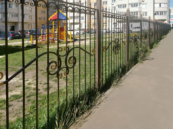 Metal fence and courtyard Stock Picture