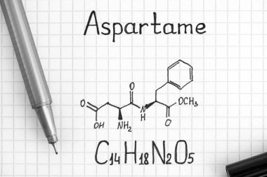Chemical formula of Aspartame with black pen. Close-up. clipart