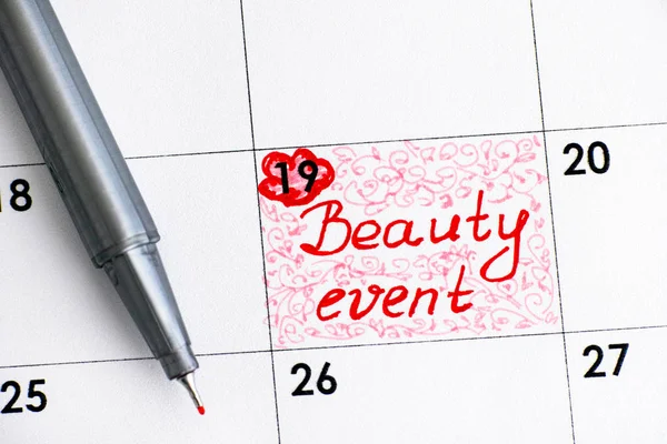 Reminder Beauty Event in calendar with red pen. Close-up.