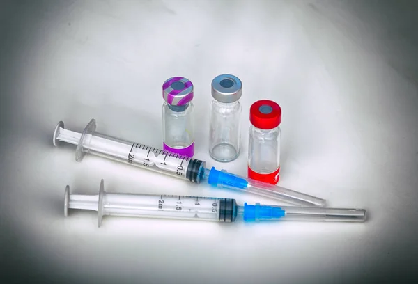 Vaccination. Syringes and vials with of vaccine for pets
