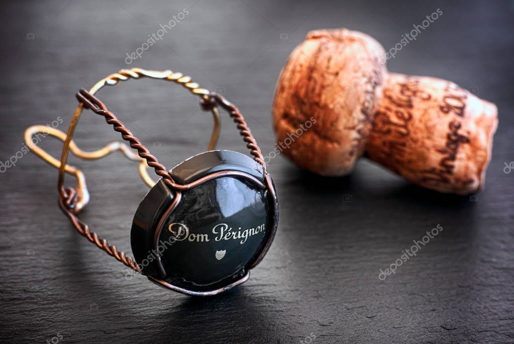 Tambov, Russian Federation - August 19, 2018 Dom Perignon Champagne cork and muselet with cap on black background. Studio shot.