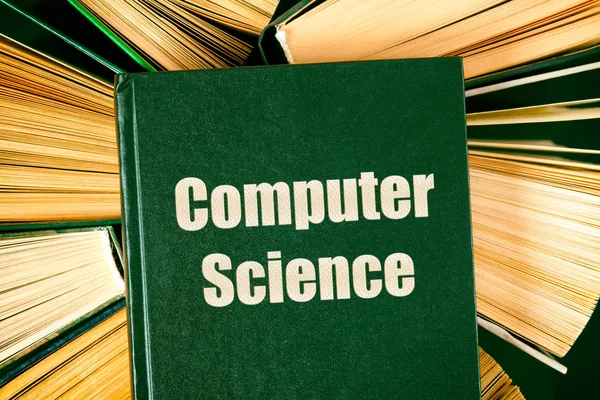 Gamla inbundna böcker med bok datavetenskap på toppen. — Stockfoto