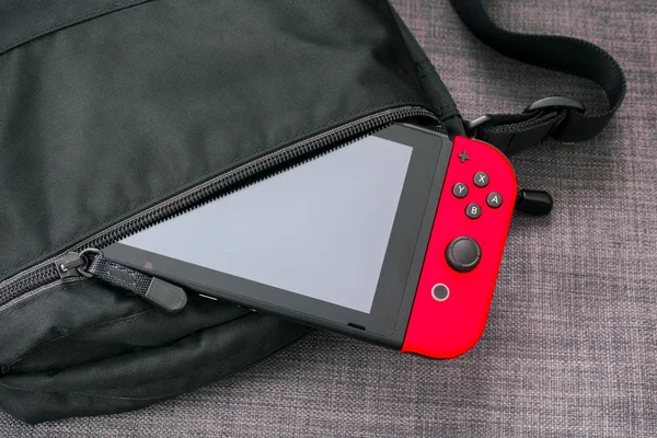 Nintendo Switch video game console in black bag. — Stock Photo, Image