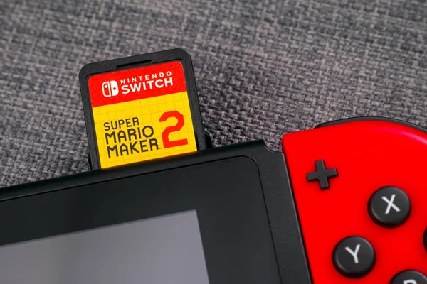 Super Mario Maker 2 video game cartridge insert into the Nintend — Stock Photo, Image
