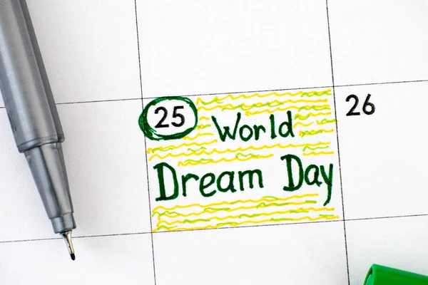 Reminder World Dream Day in calendar with green pen.