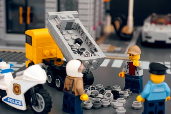 Lego dump truck dumping out load onto road due to road accident. — Stock Photo, Image