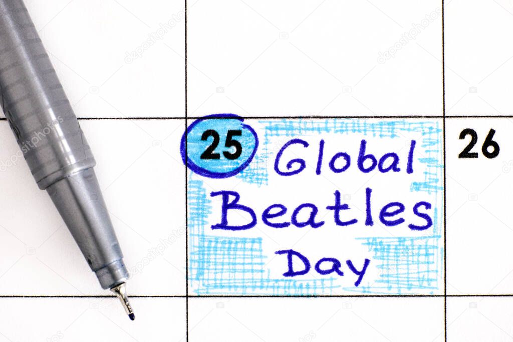 Reminder Global Beatles Day in calendar with pen. June 25.