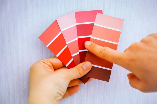 Woman Choosing Red Colour Color Swatches Wall — Stock Photo, Image