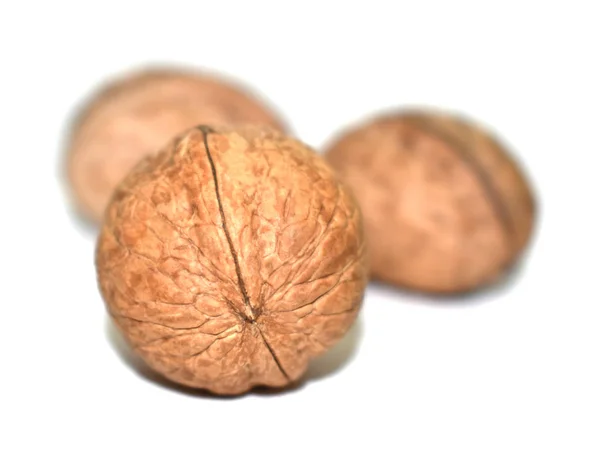 Three walnuts on an isolated white background — Stock Photo, Image