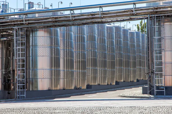 Food industry-Large modern aluminum wine fermentation tanks at a winery.  Cognac factory Shabo, Ukraine