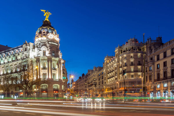 MADRID, SPAIN - JANUARY 23, 2018: Sunset view of Gran Via and Metropolis Building (Edificio Metropolis) in City of Madrid, Spain