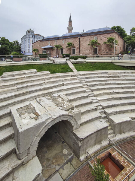PLOVDIV, BULGARIA - MAY 19, 2020: Dzhumaya Mosque and Ruins of Roman stadium in city of Plovdiv, Bulgaria