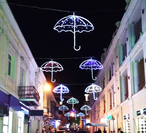 Luminous umbrellas in the city embankment of Yalta.