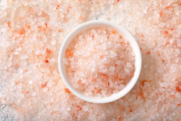 background and bowl of coarse grained Himalayan salt