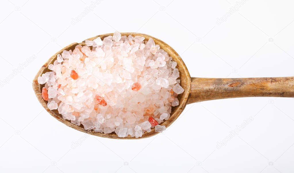 spoon of coarse grained Himalayan salt on white background
