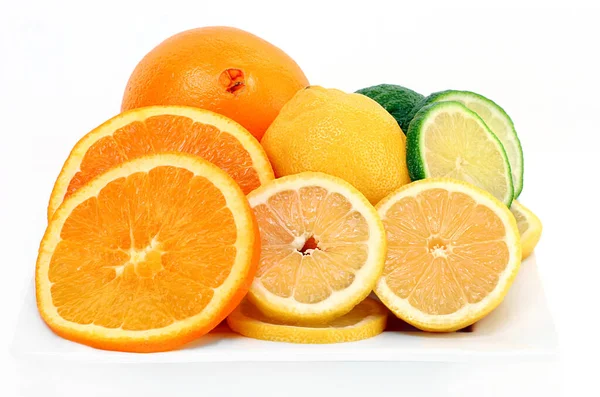 Citrus Fruits Consisting Oranges Lemons Limes Cut Whole White Plate — Stock Photo, Image