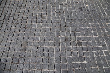 Taş kaldırım doku--granit cobblestoned kaldırım arka plan. Eski Arnavut kaldırım (closeup arka plan)  