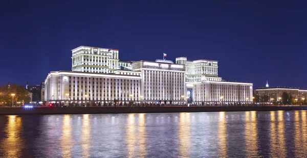 Main Building of the Ministry of Defence of the Russian Federation (Minoboron), at night-- is the governing body of the Russian Armed Forces and Moskva River. Moscow, Russia